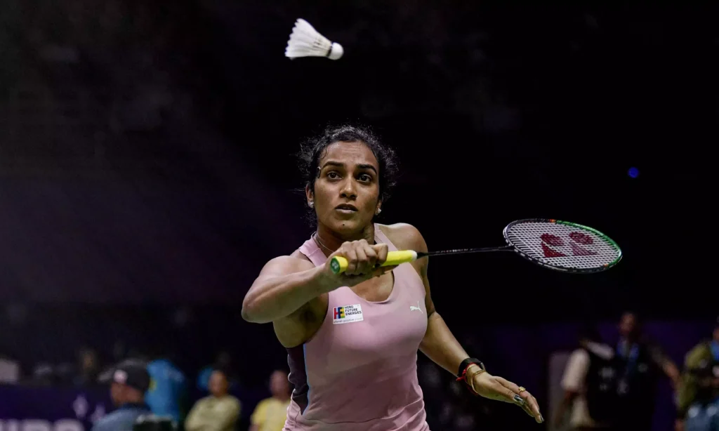 PV Sindhu holding a badminton racket during a match