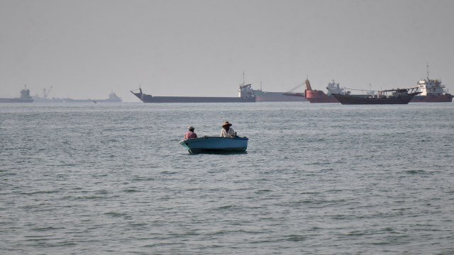 Commercial vessels and oil tankers in the Strait of Hormuz near Oman, where five Indian seafarers were rescued after a tanker attack.